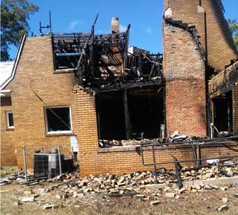 SCENE OF DESTRUCTION: Ruins of the Seventh-day Adventist Church in Griffin, Georgia, after a fire destroyed the former residence turned into a church. 