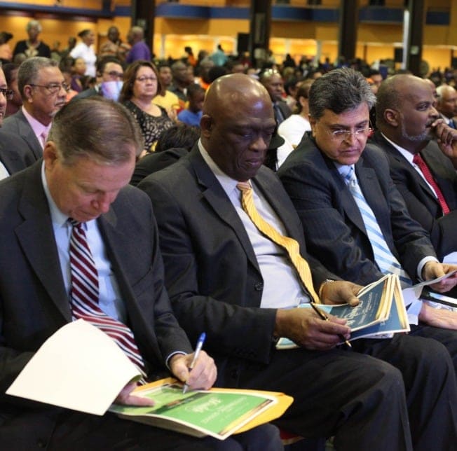 Israel Leito, center, president of the Inter-American Division, sitting with other church leaders in the Center of Excellence auditorium.