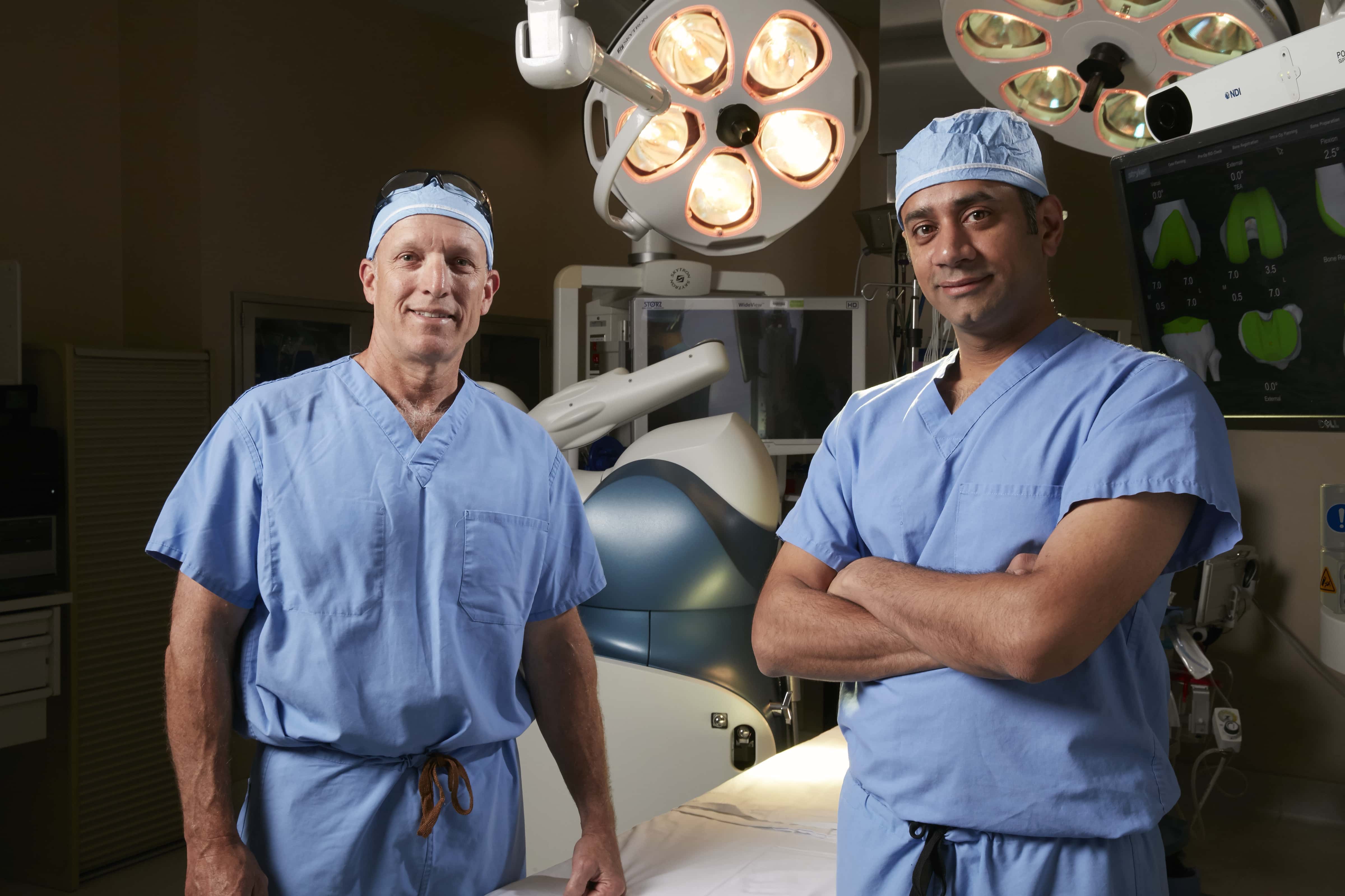 Doctors Mark Peterson, left, and Sridhar Durbhakula, who are responsible for the new robotic knee replacement procedure at Shady Grove Medical Center. [Photo: Adventist HealthCare]