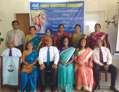 In India, SUD Family Ministries director Victor Sam and other union and conference leaders pose with Willie and Elaine Oliver (front, center) during a leadership conference.