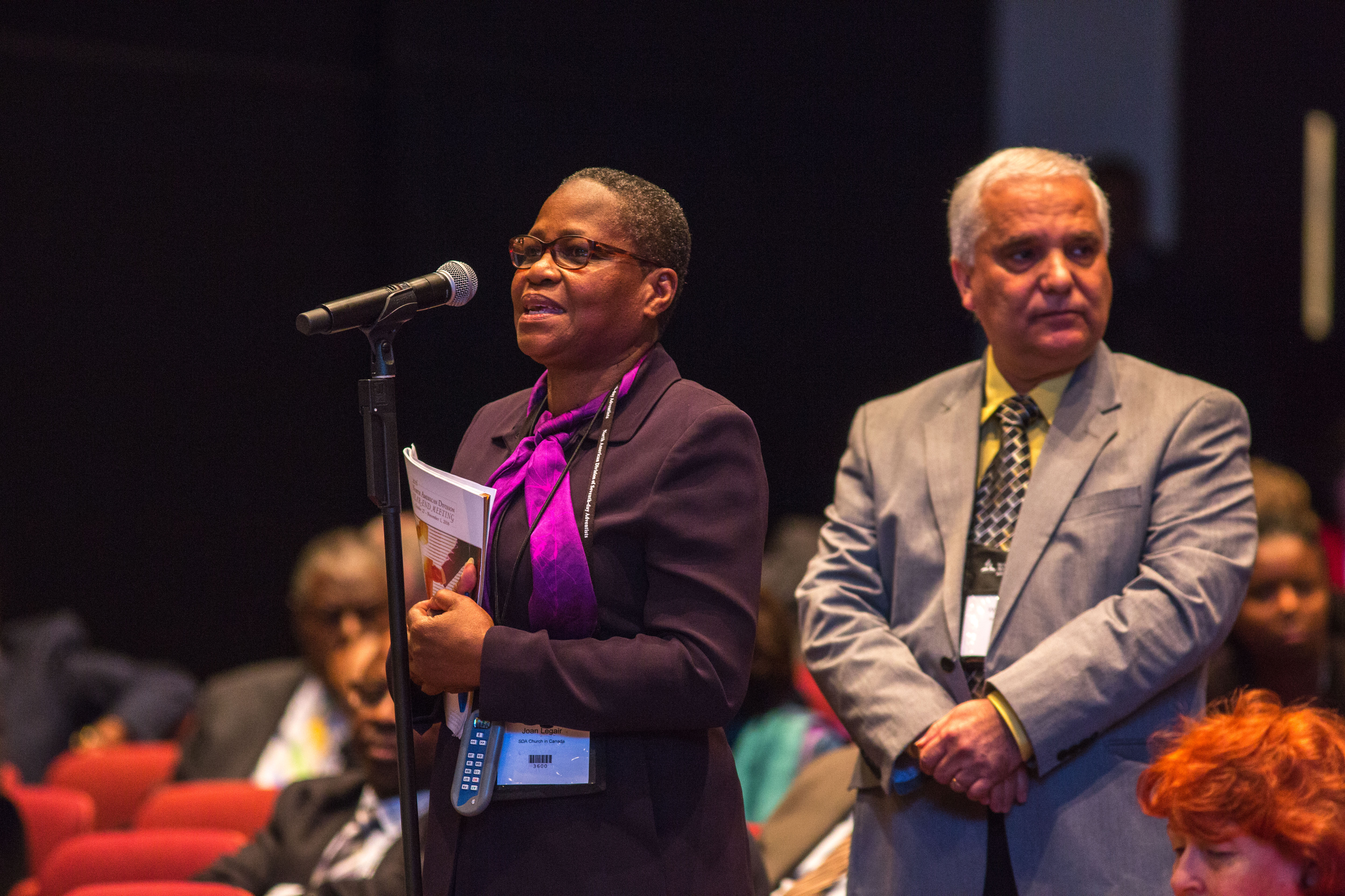 Joan Legair, a delegate from the Adventist Church in Canada, speaking to a motion seeking the creation of a response to the GC "Unity in Mission" document during the NAD Year-End Meeting. (Pieter Damsteegt / NAD)