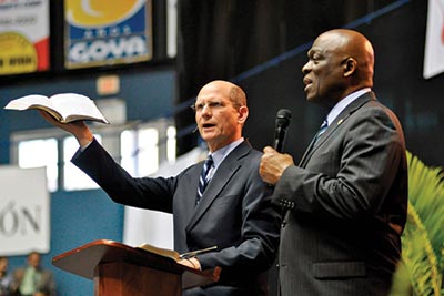 Israel Leito (right), president of the church’s Inter-American Division, translates the message during the spiritual revival launch in 2012 in Puerto Rico. Jaime Crespo