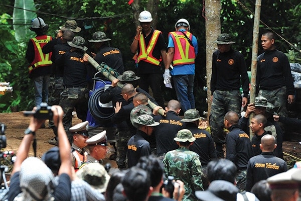 Rescue teams race against time to save 12 boys and their soccer coach from a flooded cave in Thailand. ©Rachen Sageamsak/Xinhua via ZUMA Wire