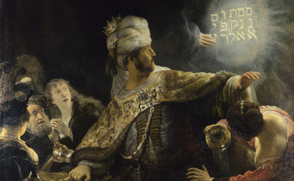 Belshazzar seeing the writing on the wall as depicted by Rembrandt.