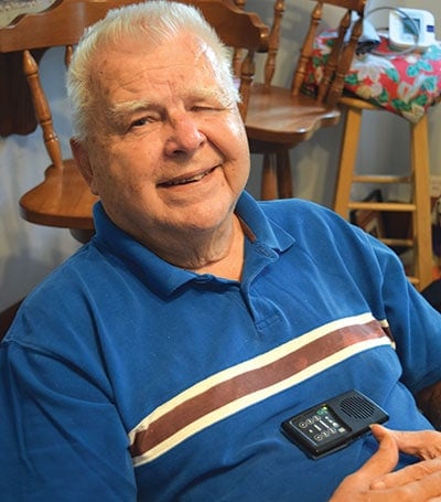 William Latke, Navy lieutenant (junior grade) retired, enjoys listening to encouraging stories and portions of the Bible on his inSight4Vets player.