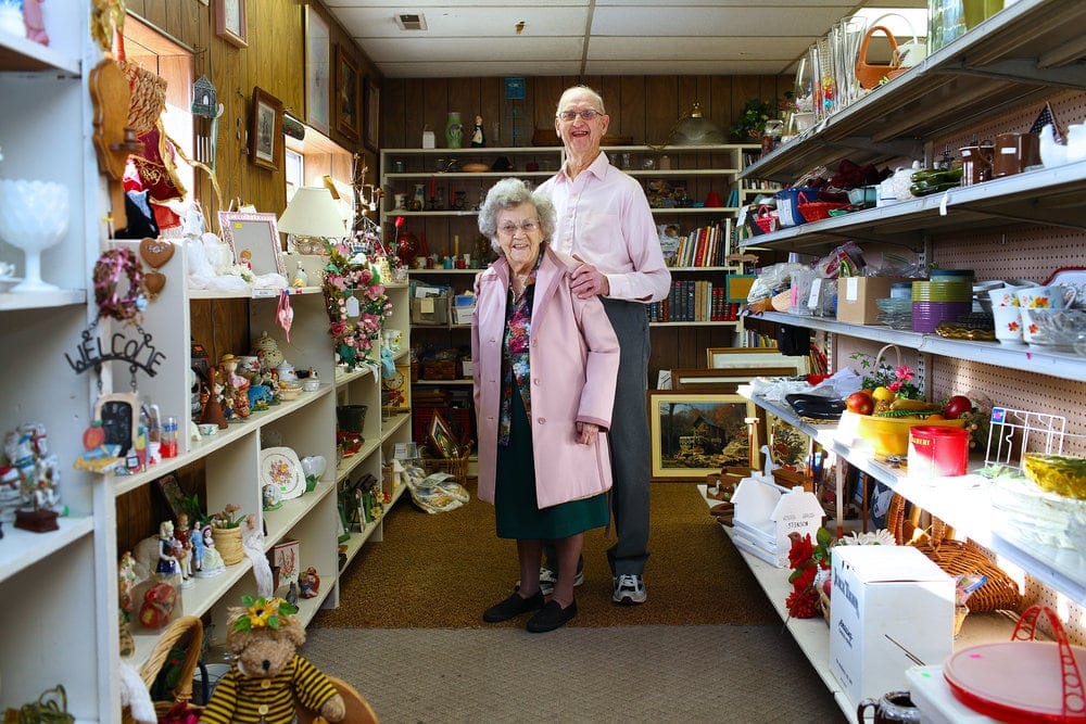 Vera Norman, 101, and Jim Spitler, 92, standing in the thrift shop of the Newark Adventist Community Service Center in Newark, Ohio. (Michael F. McElroy / Visitor)
