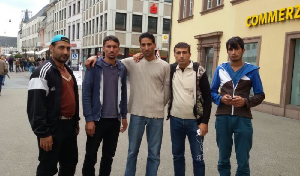 Sajid Safi, center, with his friends in Germany. (TED)