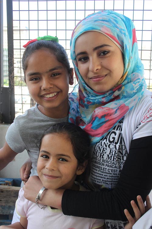 Diana with a 15-year-old classroom assistant, also a refugee.