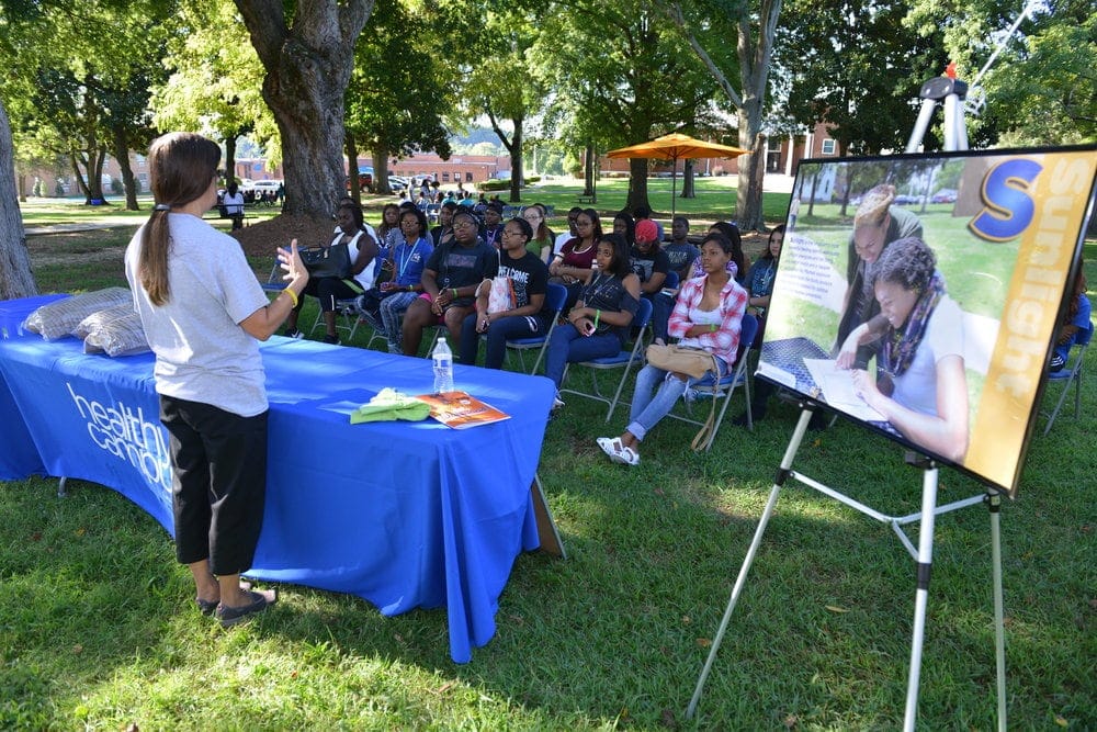 Students studying sunlight, one of the eight laws of health, at freshman orientation. (Anthony Chornes II / Oakwood University)