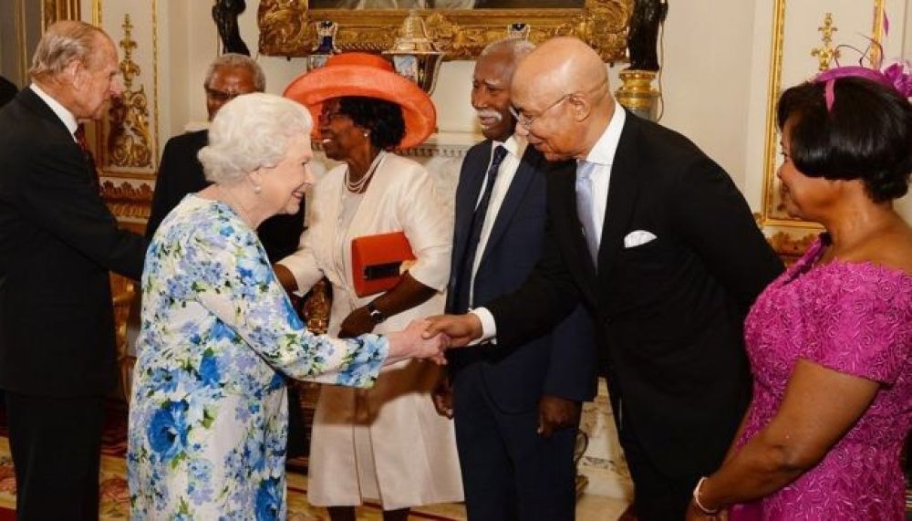 Queen Elizabeth II greeting Patrick Allen, governor-general of Jamaica, and his wife at the June 10 birthday event. (Richard Daly / BUC)