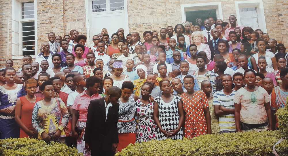 Nancy Costa posing with baptismal candidates at the Kabusunzu church in Kigali, Rwanda.