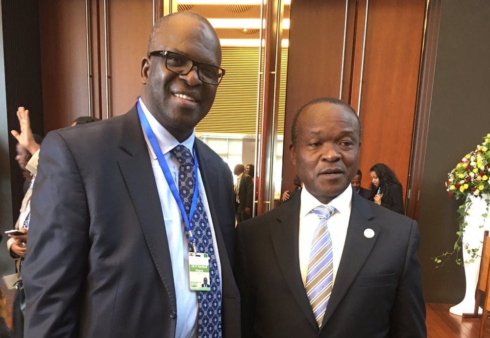 Ganoune Diop, left, with Erastus Mwencha, deputy chair of the African Union Commission, at the prayer breakfast.