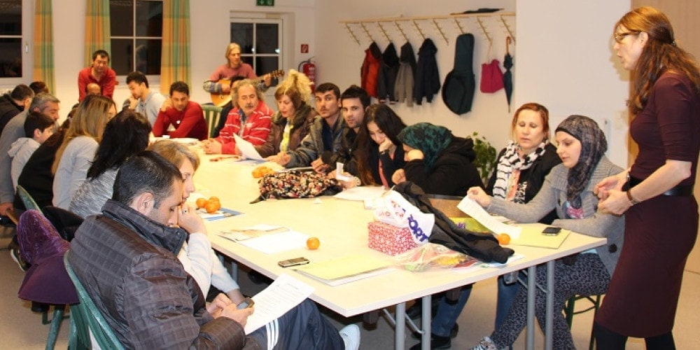 Migrants attending a German-language course organized by the Adventist church in Braunau, Austria. 