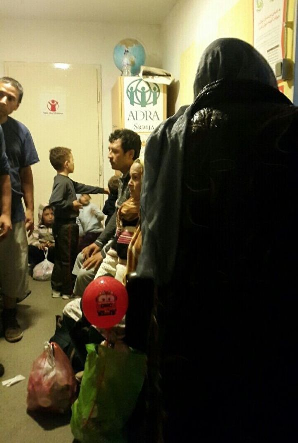 Refugee families receiving assistance on the upper floor of the refugee center in Belgrade. (Igor Mitrović)