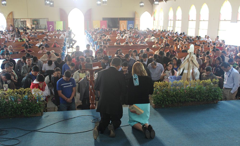 People praying during a weeklong prayer marathon at Venezuela Adventist University in Nirgua, Venezuela.