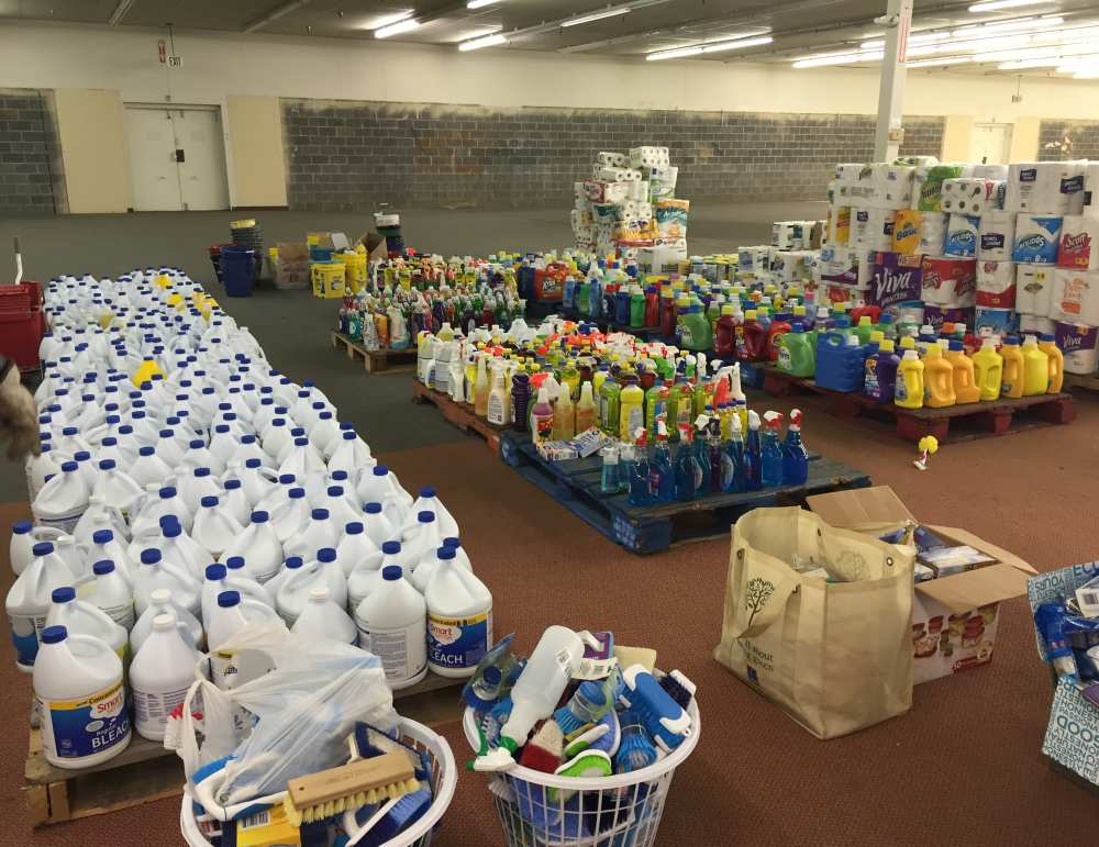 Cleaning supplies and drinking water awaiting distribution at the Belle warehouse on Wednesday.