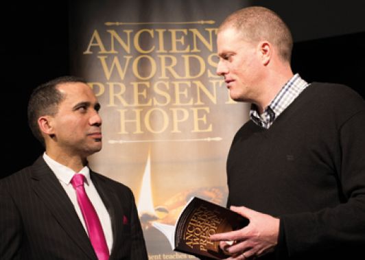 Kayle de Waal, left, and Nathan Brown speaking at the symposium. (Adventist Record)