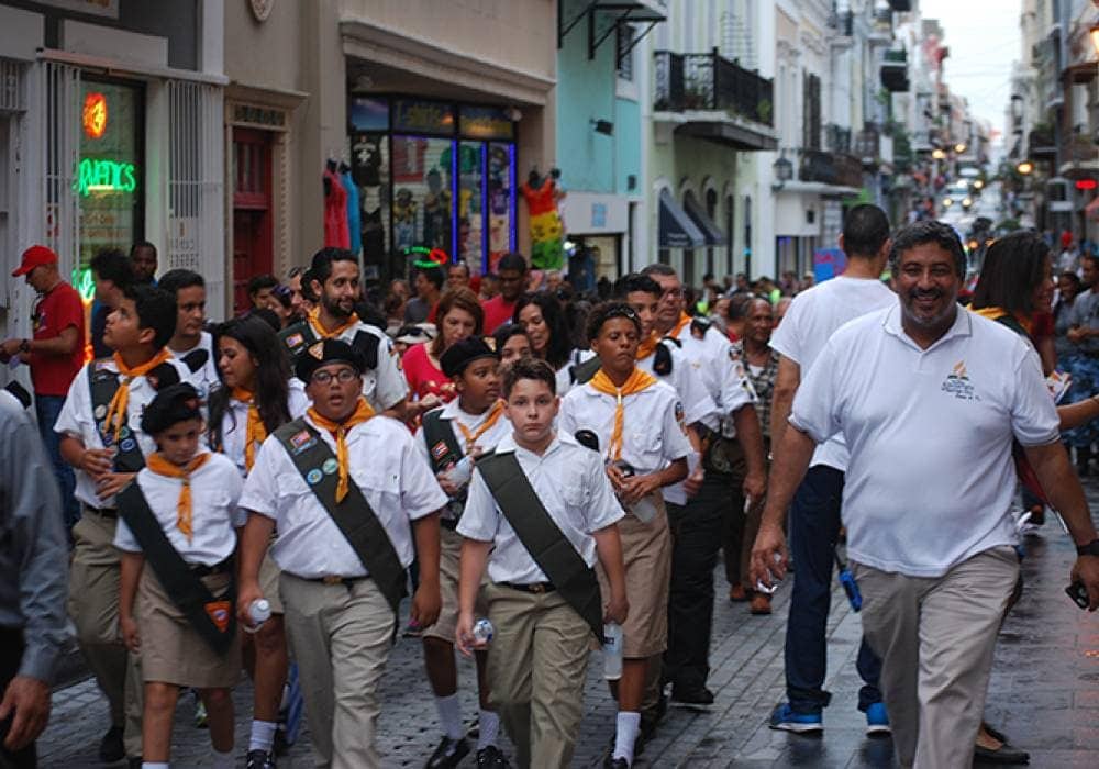 A Pathfinder club heading down a street of San Juan during the march.