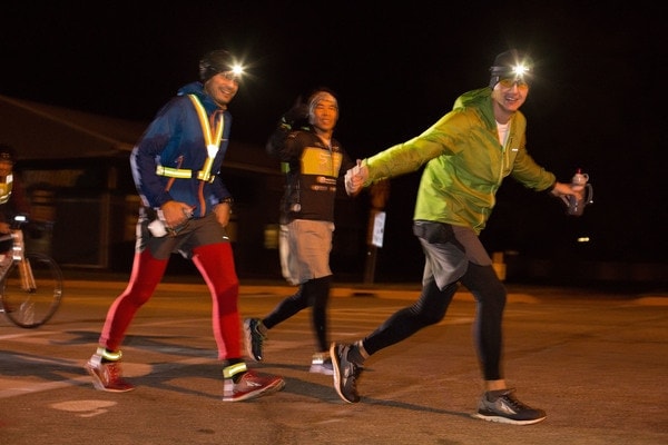 L-R: Oliver Glanz, Calvin Kim, Oleg Kostyuk. Their run began at dusk, and the first half of the run was done in the dark. The crew stuck to back roads and had a car with headlines on with them at all times to provide lighting for safety. (Photo by Darren Heslop)