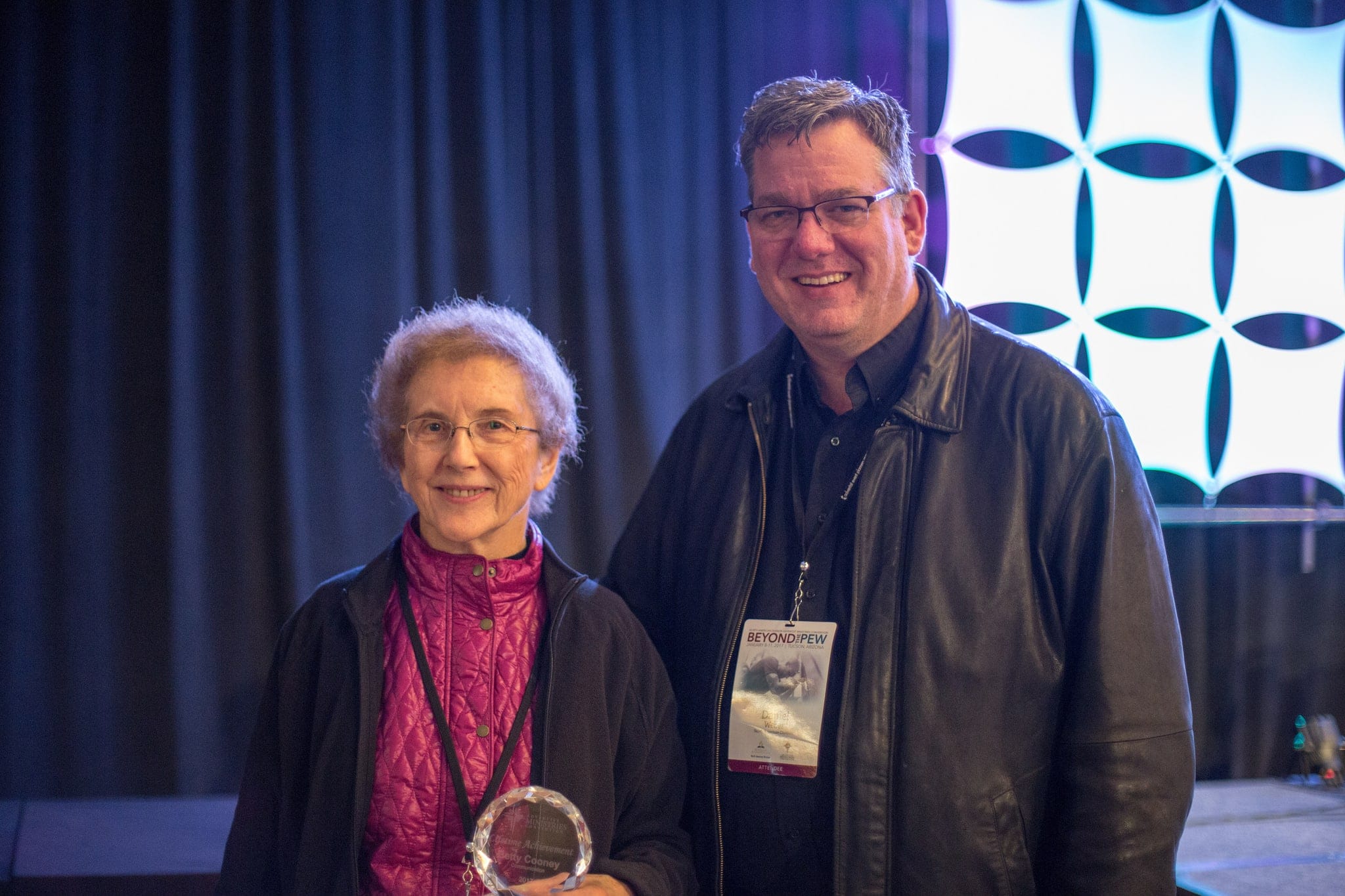 Dan Weber presents Betty Cooney with the 2017 AMC Lifetime Achievement Award in Communication at the ministries convention held in Tucson, Arizona.