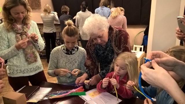A group of children, parents, and grandparents enjoy hands-on learning about creative ways for fostering children's spirituality, in Riga, Latvia, last month. [Photo: Karen Holford, TED]