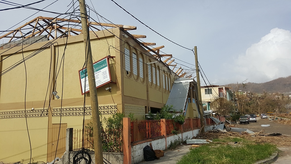 The Roseau Adventist Church in Roseau, Dominica, lost its roof and was damaged inside after Hurricane Maria battered the island on Sep. 18. Twenty-nine Adventist churches were completely destroyed and only five can operate now. [Photo: Samuel Telemaque, Inter-American Division News]