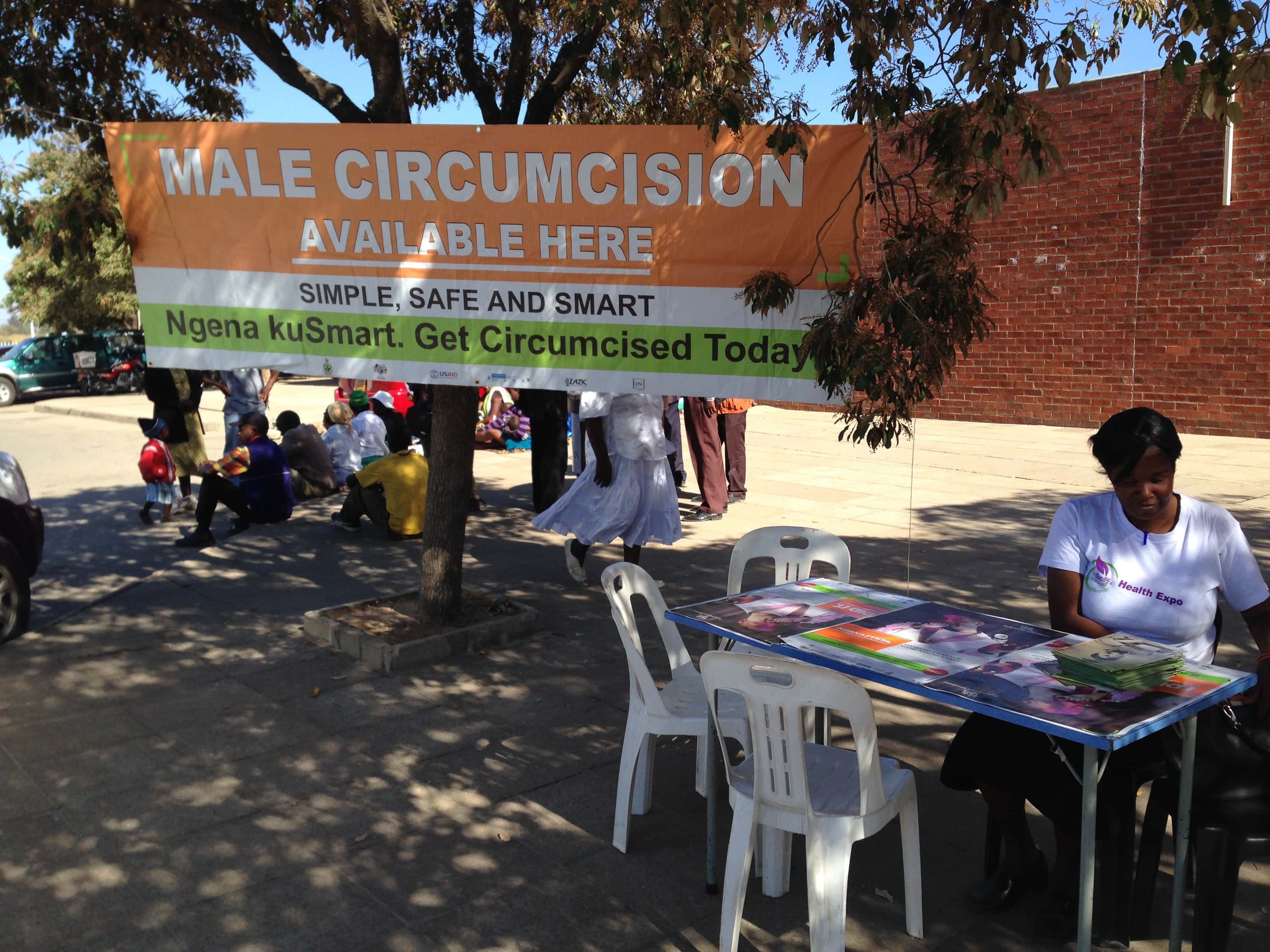 A booth offering to take males to a nearby government hospital for free circumcisions. (Andrew McChesney / AR)
