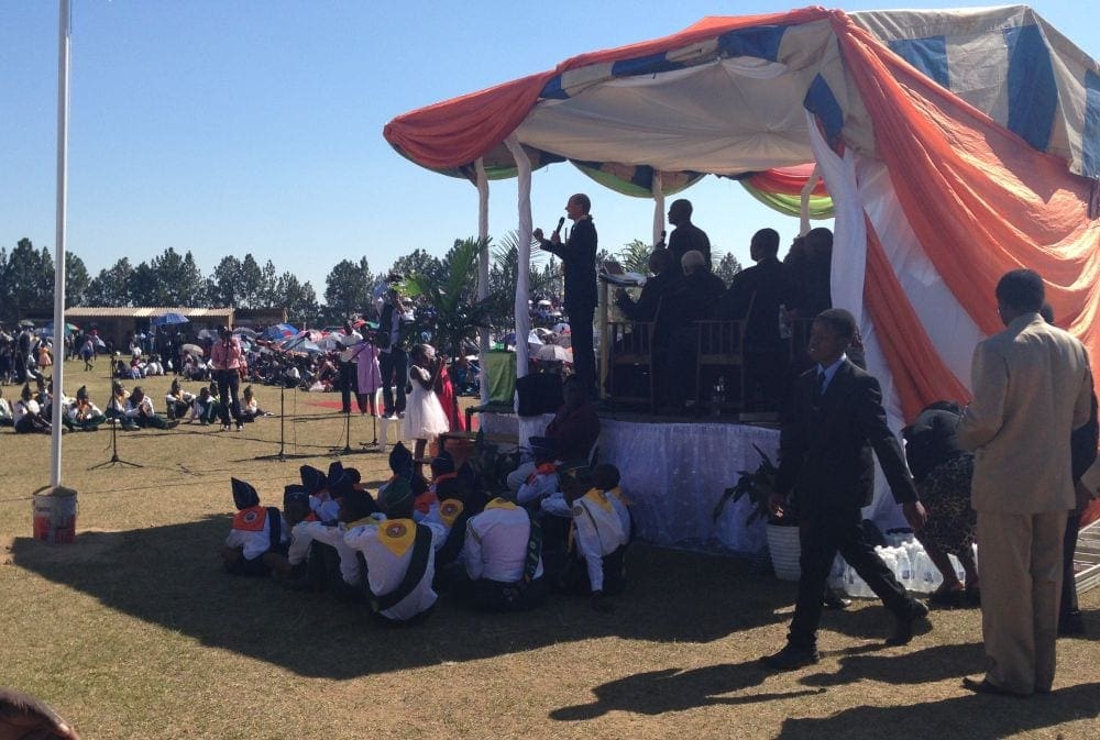 Pathfinders sitting in the shade as they listen to Wilson speak to 20,000 people in Gweru. (Andrew McChesney / AR)