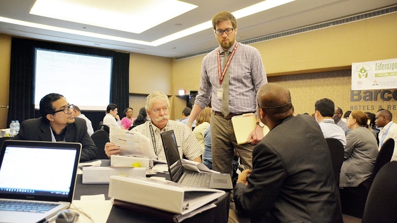 Peter Gleason, PhD, assistant professor at LLU School of Public Health, answers a question during the certificate in healthcare administration program session in Cancun, Mexico. [Photo: Rafael Molina/Loma Linda University News]