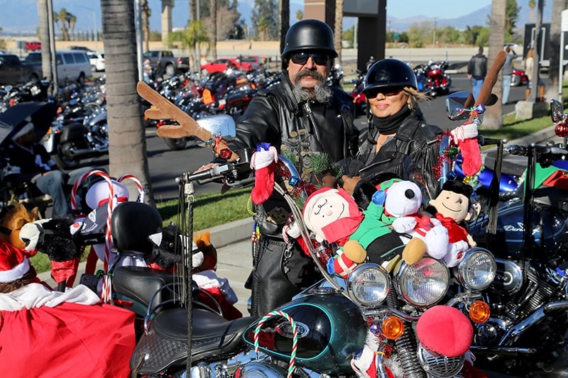 Bikers go all out to share the love with children at Christmas. This couple won the prize for best decorated bike at the 24th annual Quaid Harley-Davidson Toy Run.  Credit: Loma Linda University Health