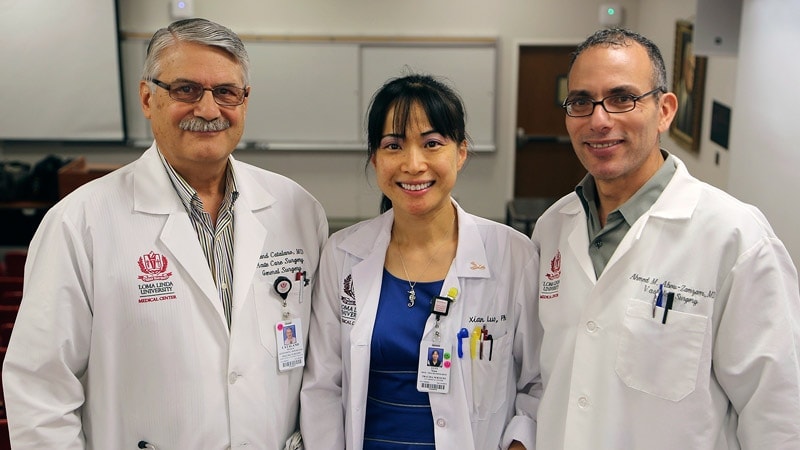 Richard Catalano, MD, Xian Luo, PhD, and Ahmed Abou-Zamzam, MD, celebrate the news that the National Trauma Institute recently received a $4.6 million Department of Defense grant to develop a National Trauma Research Repository (LLU Photo)