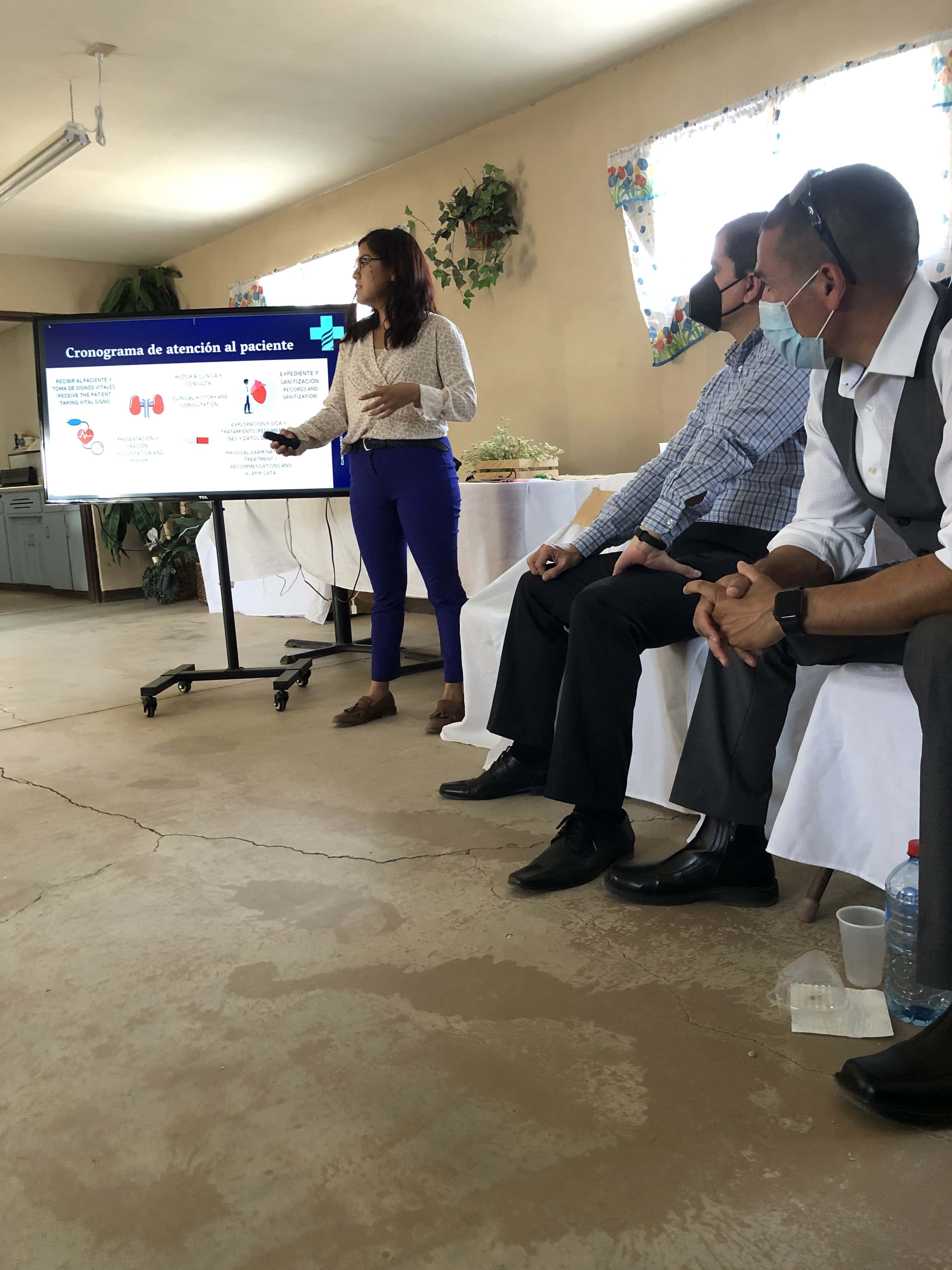 In Valle de la Trinidad, Baja California Sur, Mexico, clinic administrator Yetlanezy Olguín (standing) provides information about the local community and the need for the clinic. [Photo: Adventist Health]