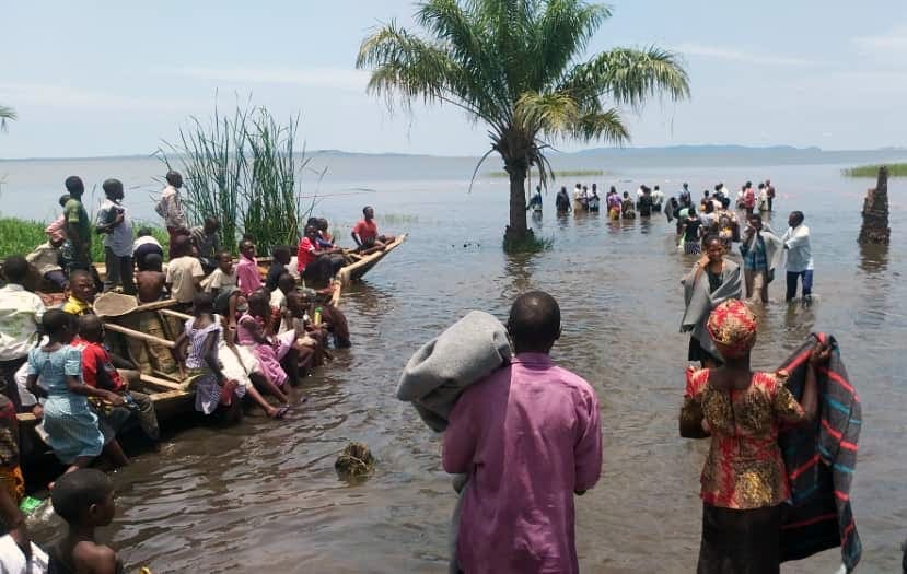 One of many baptisms at a lake in Chato, Geita, Tanzania. Recent evangelistic efforts resulted in revival for church members across Tanzania and brought thousands of new members to the church. [Photo: Breath of Life, North American Division News]
