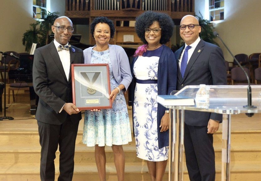 Jeffrey and Pattiejean Brown (left) receive the Arthur & Maud Spalding Medallion from Willie and Elaine Oliver, General Conference Family Ministries directors. [Photo: Walter Martinez]