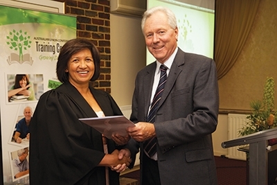 Beryl Landers receiving certificate. [Photo: SPD Record]