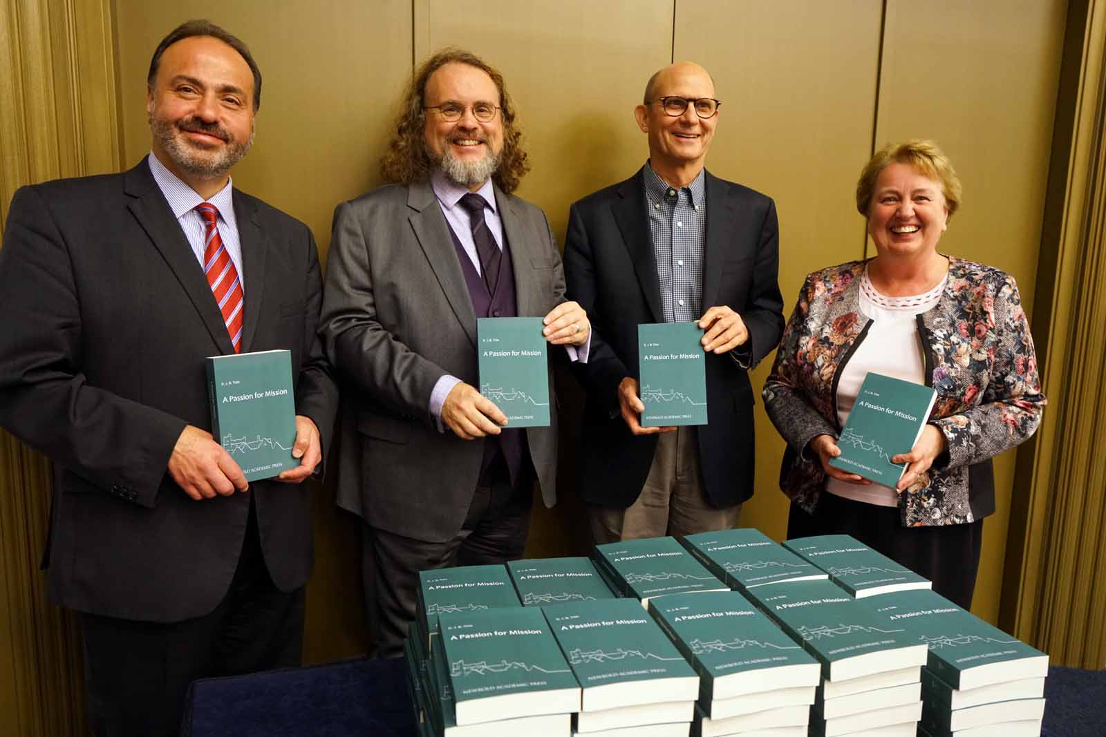 A Passion for Mission official book launch. From left to right, Trans-European Division (TED) president Raafat Kamal, Adventist author and historian David Trim, Adventist Church president Ted Wilson, and TED executive secretary Audrey Andersson. [Photo: Victor Hulbert, Trans-European Division News]