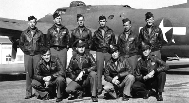 The crew of "Ye Olde Pub." Richard Pechout (back row, third from left;, Sam Blackford (back row far right). Kneeling: Charles "Charlie" Brown (far left. [American Air Museum in Britain]