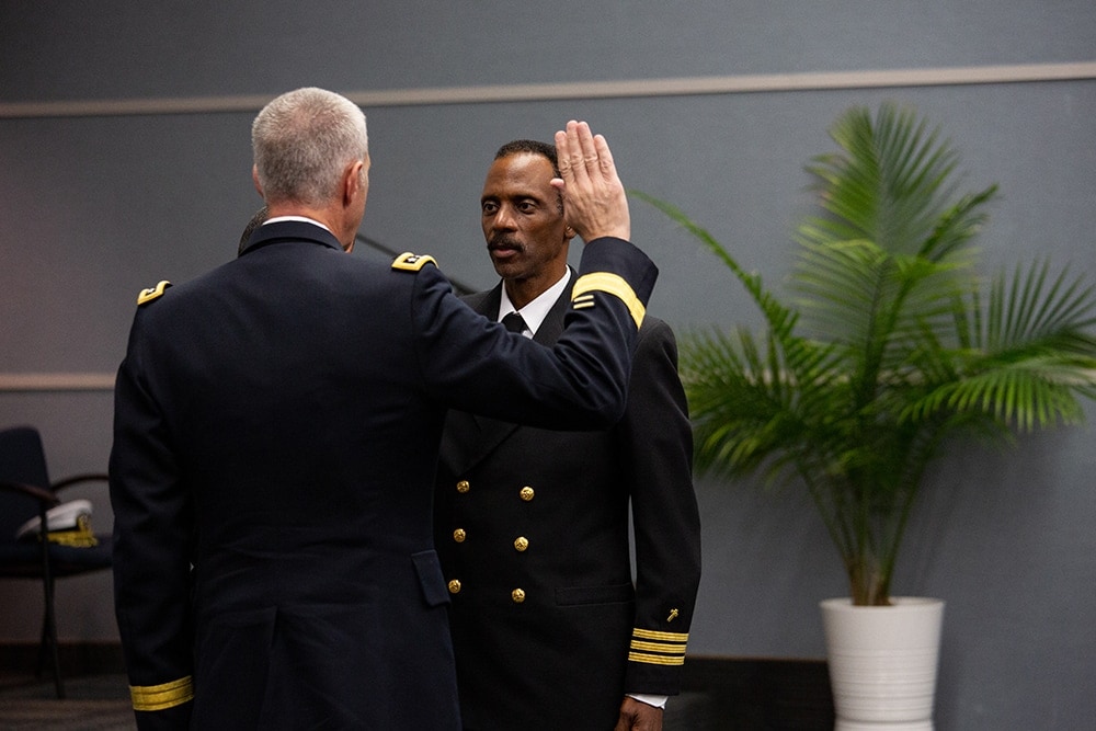 Lt. General Reynold Hoover administers the oath of office to Washington Johnson II as part of Johnson’s promotion ceremony at the North American Division regional headquarters on October 8, 2018. [Photo: Mylon Medley, North American Division News]