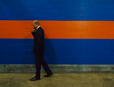Ted Wilson prays with his wife Nancy over the phone behind the Session stage. Photo: Josef Kissinger