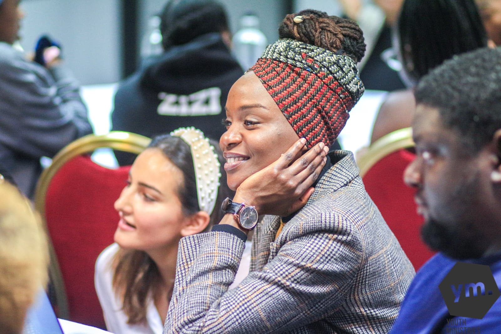 Attendees smile during presentations at the South England Conference (SEC) Youth Leadership Conference 2020 held in London. The event drew more than 60 youth leaders January 24-26, 2020. [Photo: Aaron Fenton-Hewitt]