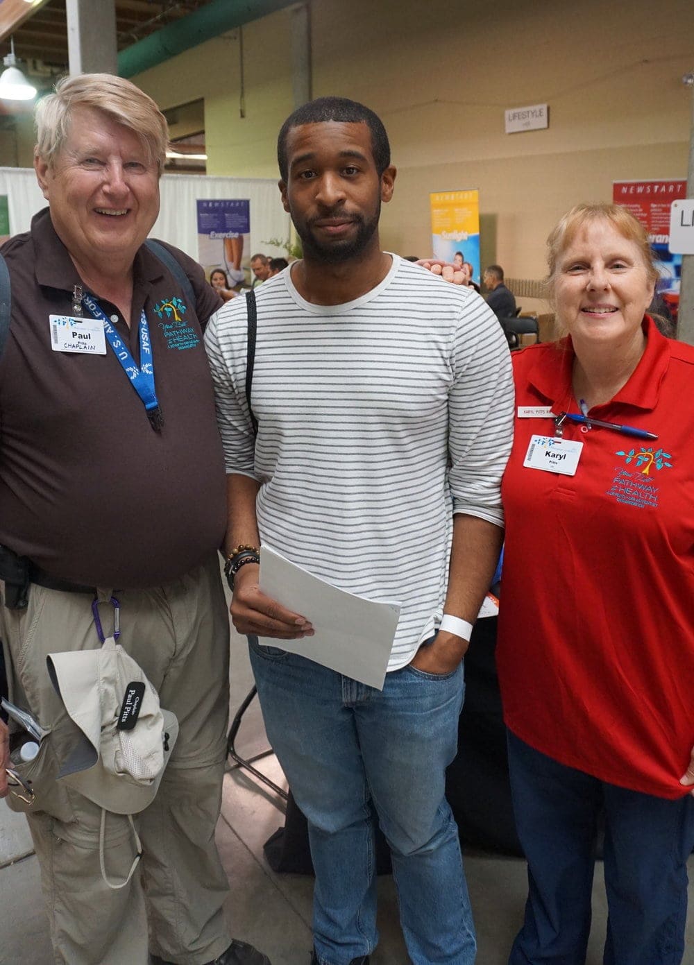 Kerwin Foster, center, attending the mega-clinic with his hosts, Paul and Karyl Pitts. (Melissa Ish)
