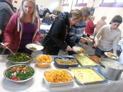 <strong>MORNING FARE:</strong> Visitors at the Banbridge Seventh-day Adventist Church in Northern Ireland sample healthy fare while helping raise funds for Philippine typhoon relief.