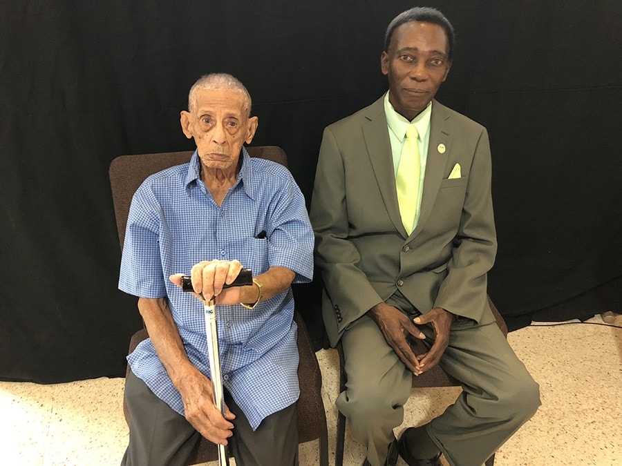 Carlos Ortiz García (left) sits next to Gibbs Pierre (right), pastor of the San Jose Adventist Church in San Juan, Puerto Rico. [Photo: East Puerto Rico Conference, Inter American Division News]