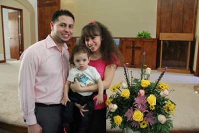 Caleb Caraballo & Ednalisse , Jr.JPG: Caleb Caraballo (pictured with his wife, Ednalisse and son), the son of a prominent Baptist minister, re-examined his beliefs and joined the Adventist Church.[Photos: CU Visitor]