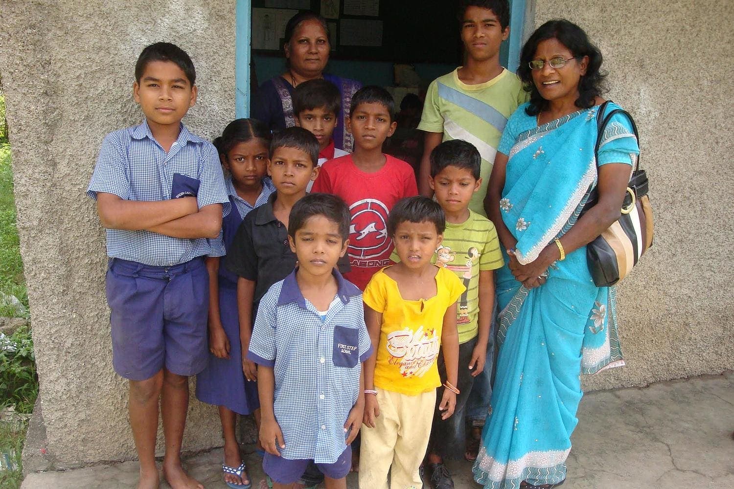  Dr. Solomon (far right), poses with students she met at a school in Pune, India, while conducting teacher training and exploratory studies. [Photo: La Sierra University]
