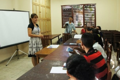 Dayami Rodriguez, communication director for the church in Cuba, teaches a class in Camaguey during the two-region training workshops.  