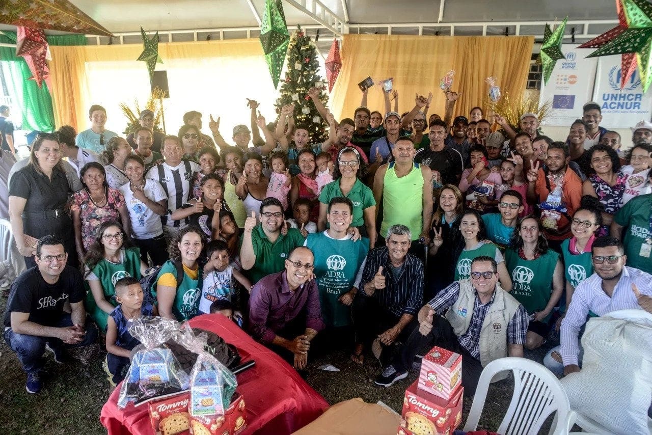 Group picture of the Venezuelan refugees and Adventist volunteers at the Adventist-sponsored Christmas dinner in Manaus, Brazil, on December 23, 2018. [Photo: South American Division News]