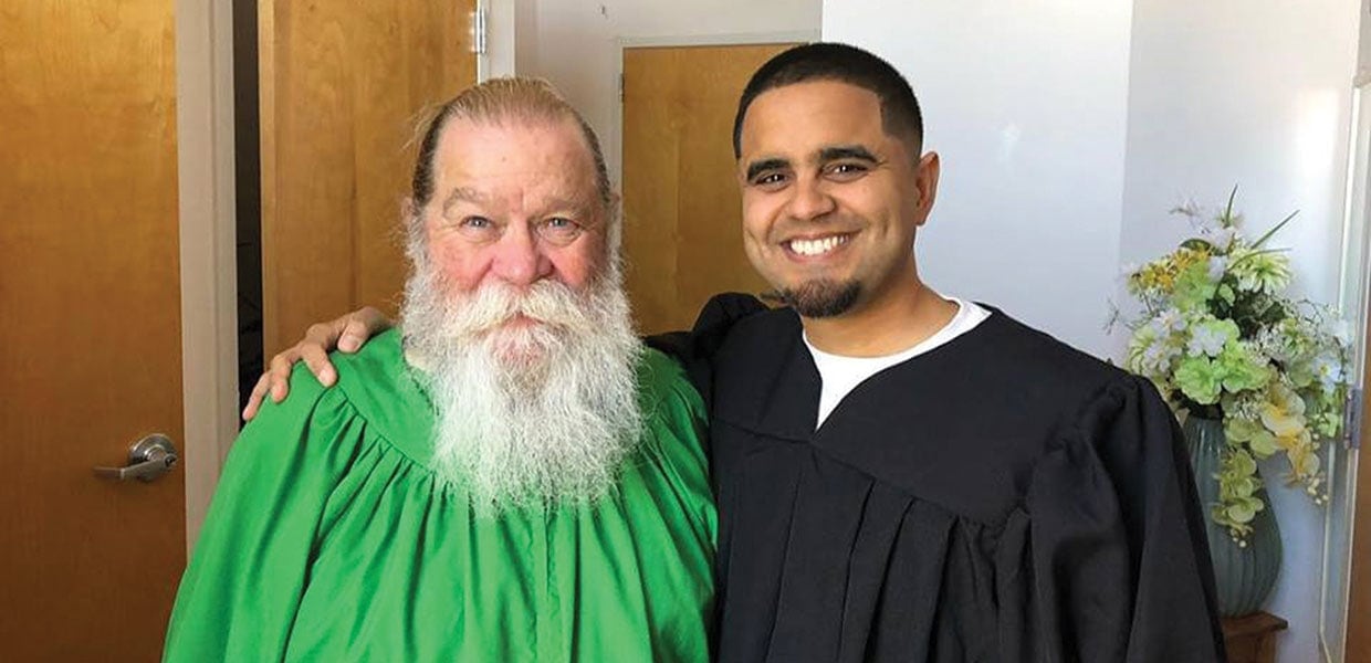 True James Williamson (left) with Jay Rosario, a few minutes before Williamson’s baptism at the Panama City Seventh-day Adventist Church in December 2018. [Photo: Southern Tidings News]