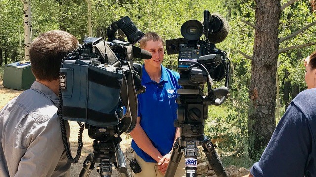 Camp staff member Dylan is interviewed by various media after surviving a bear attack. [Photo: Rajmund Dabrowski]