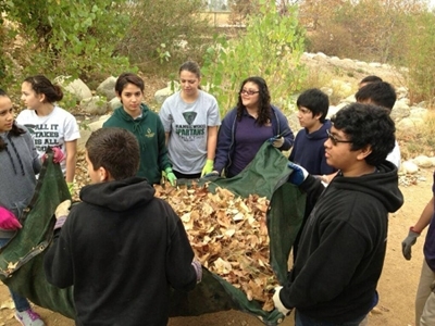 Orangewood Academy TOAST students learn biology lessons while cleaning up local parks. [Photo: PUC Record]